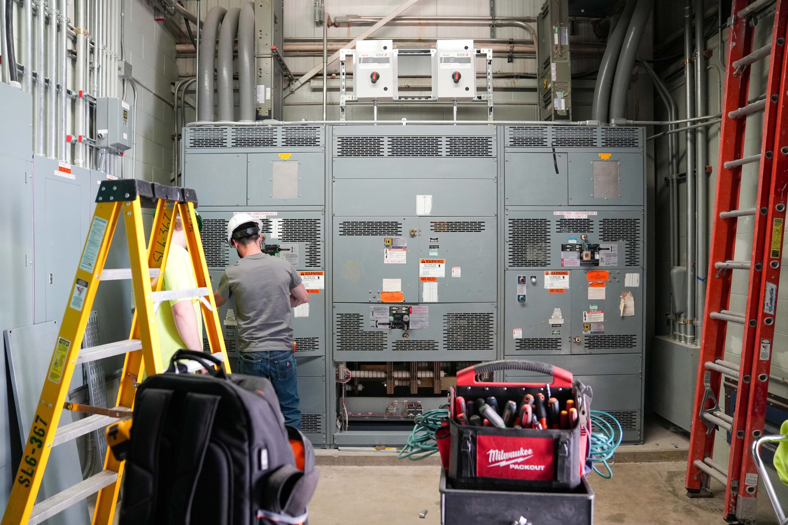 Buist electricians performing switchgear testing during scheduled shutdown.