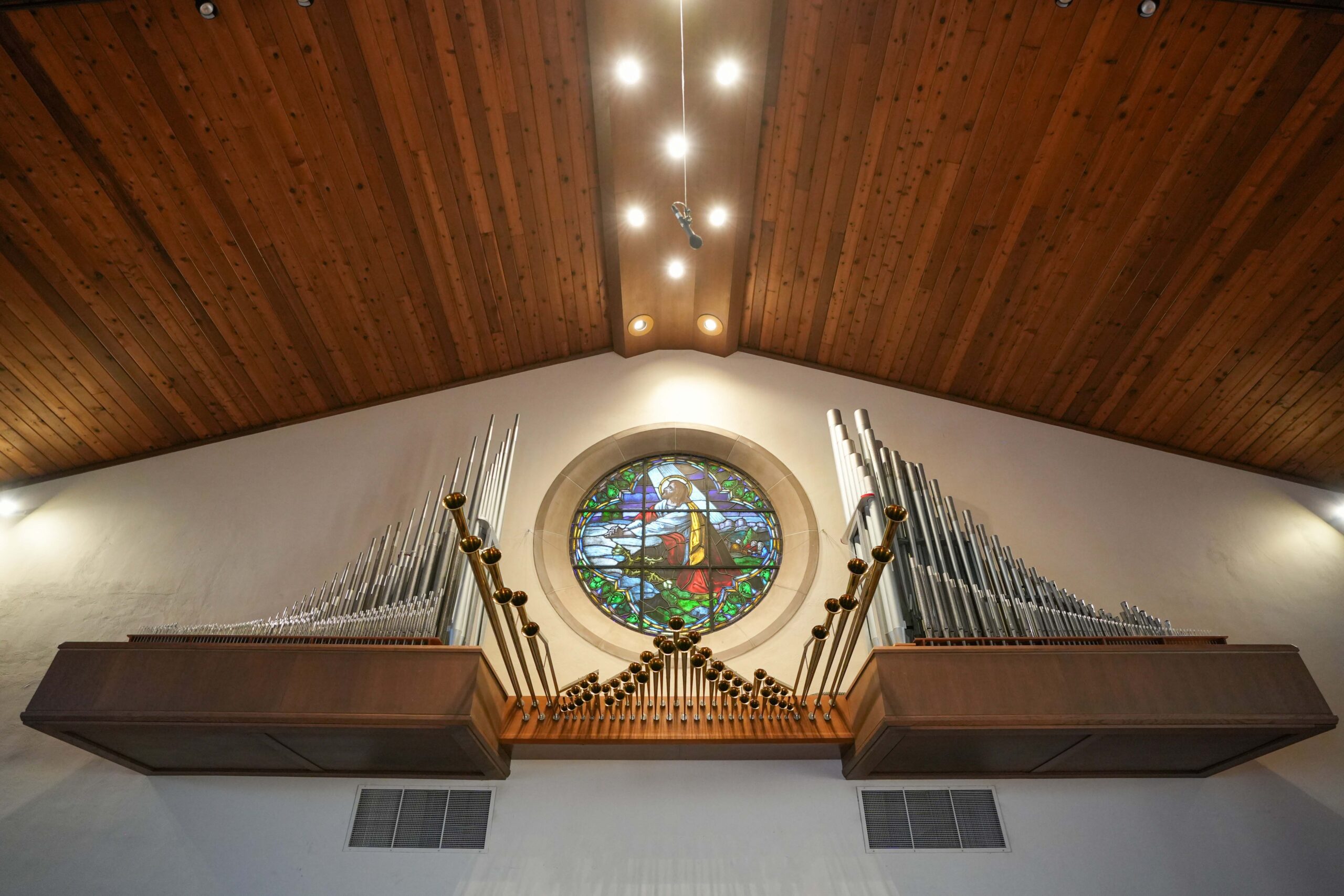 Pipe organ and round stained-glass window at LaGrave Avenue Christian Reformed Church in Grand Rapids, Michigan.