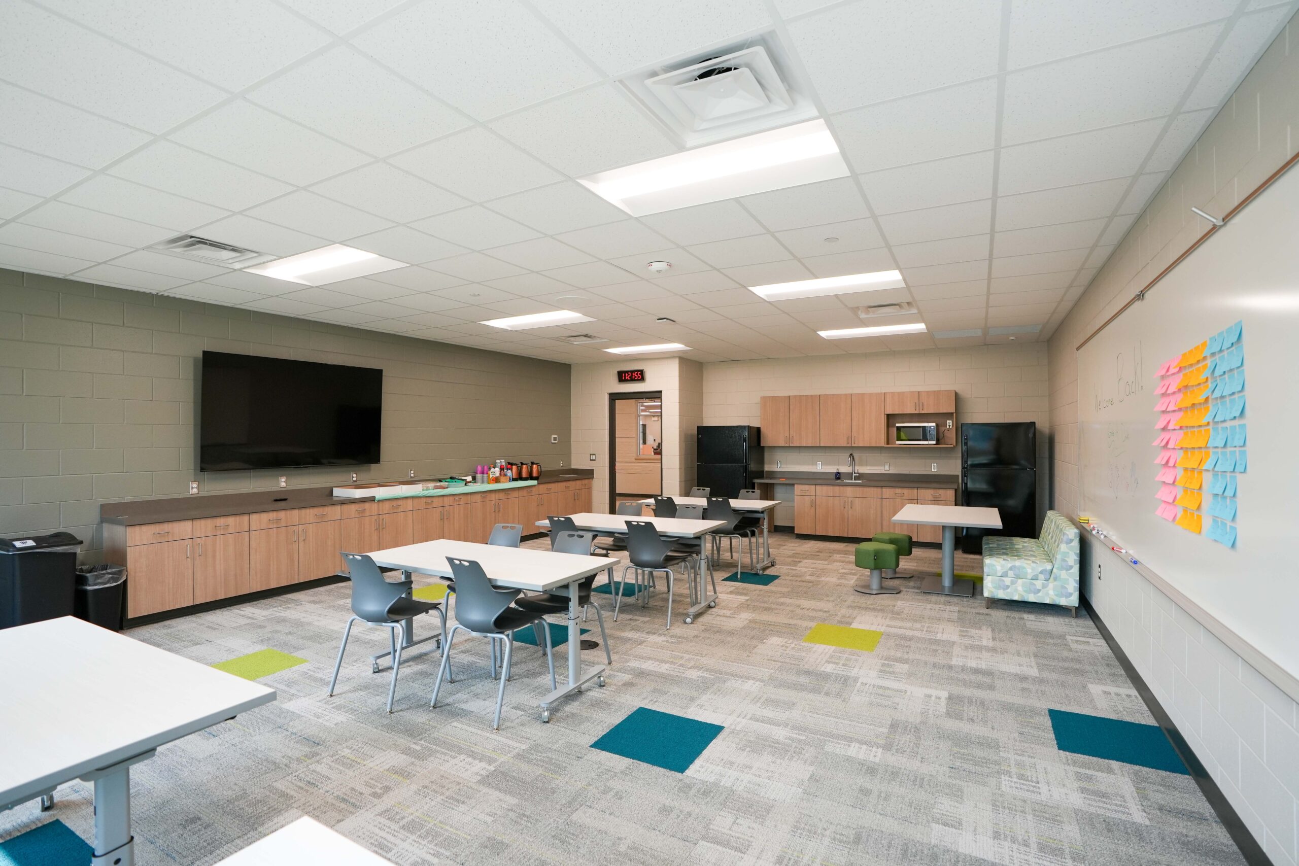 Classroom at Moline Christian School with interactive display, updated lighting, and flexible student seating.