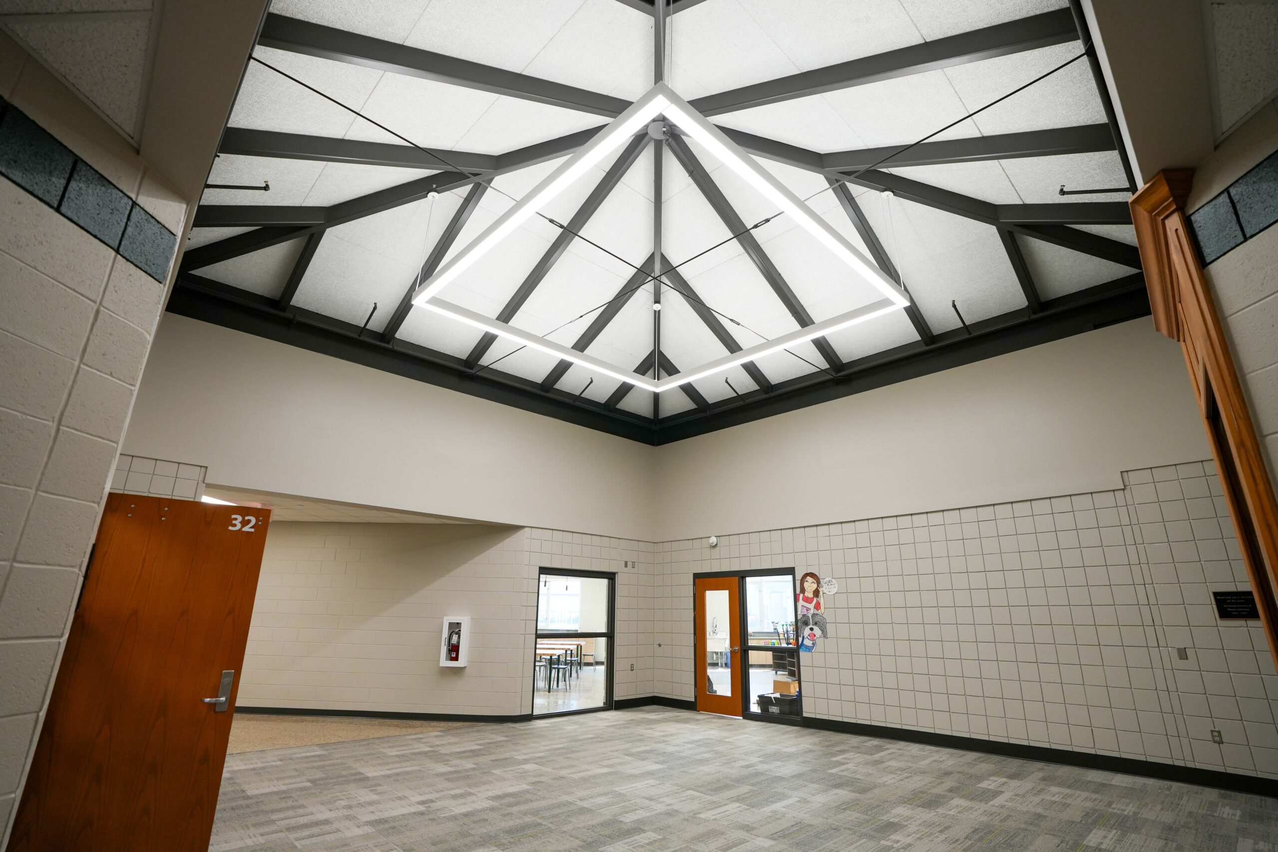 Hallway at Moline Christian School with architectural lighting installed by Buist.