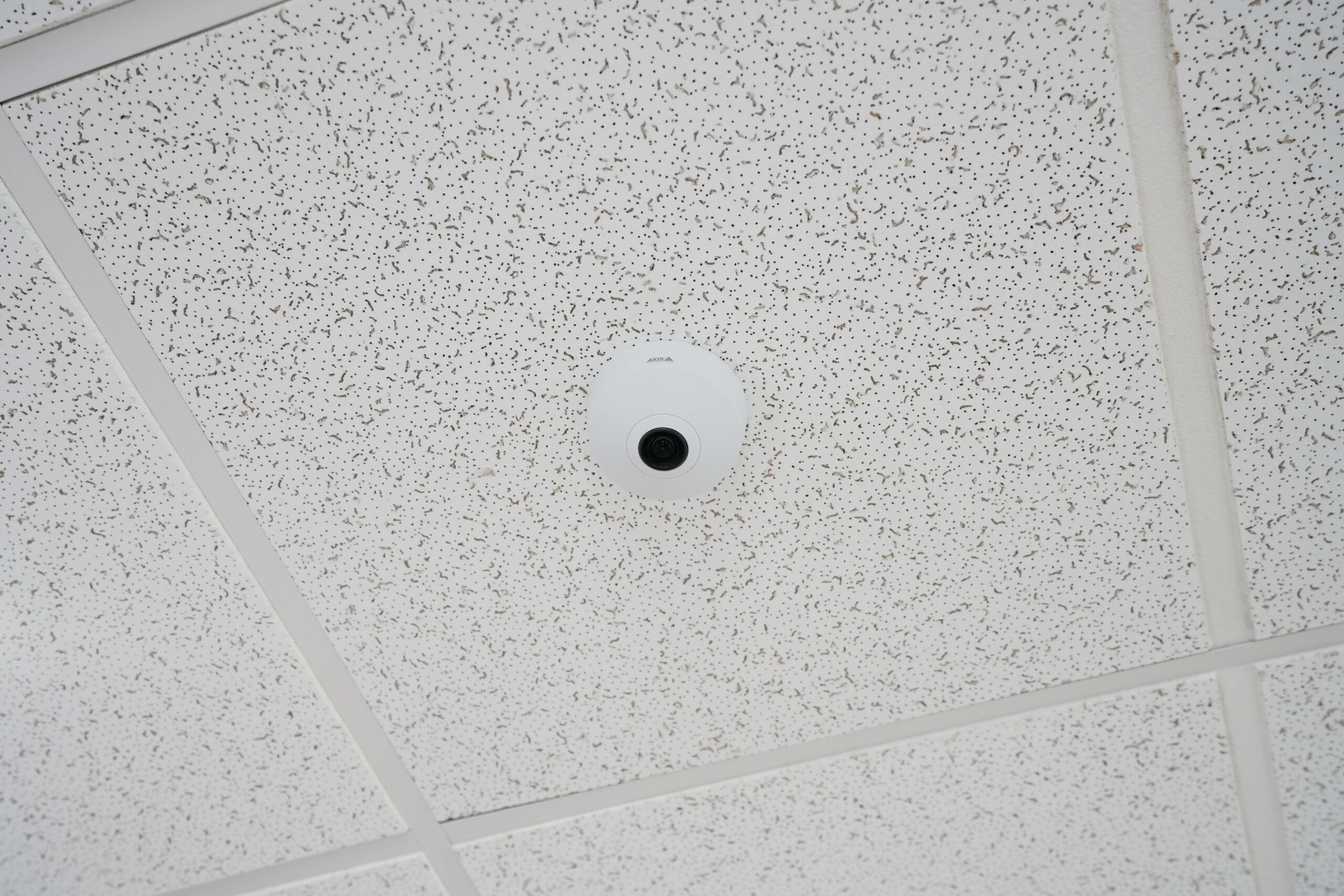 Ceiling-mounted security camera installed by Buist at Byron Township Fire Department for comprehensive building surveillance.