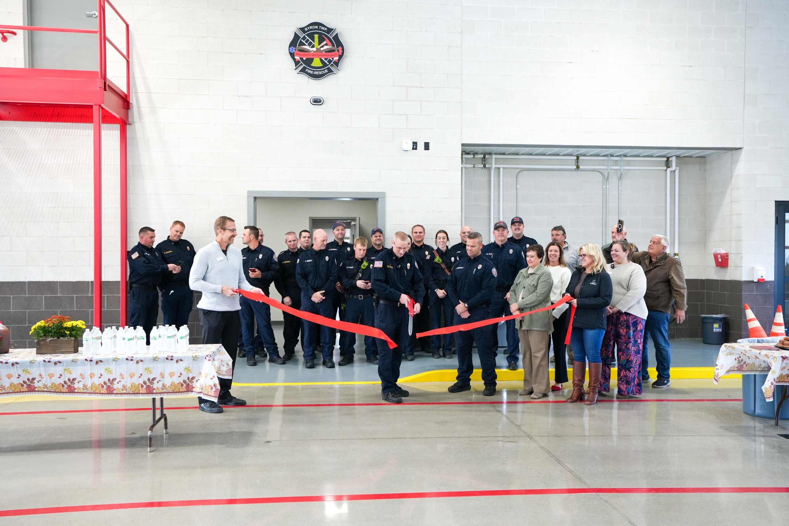 Firefighters and community members gather for the ribbon-cutting ceremony celebrating Byron Township Fire Department’s new station.