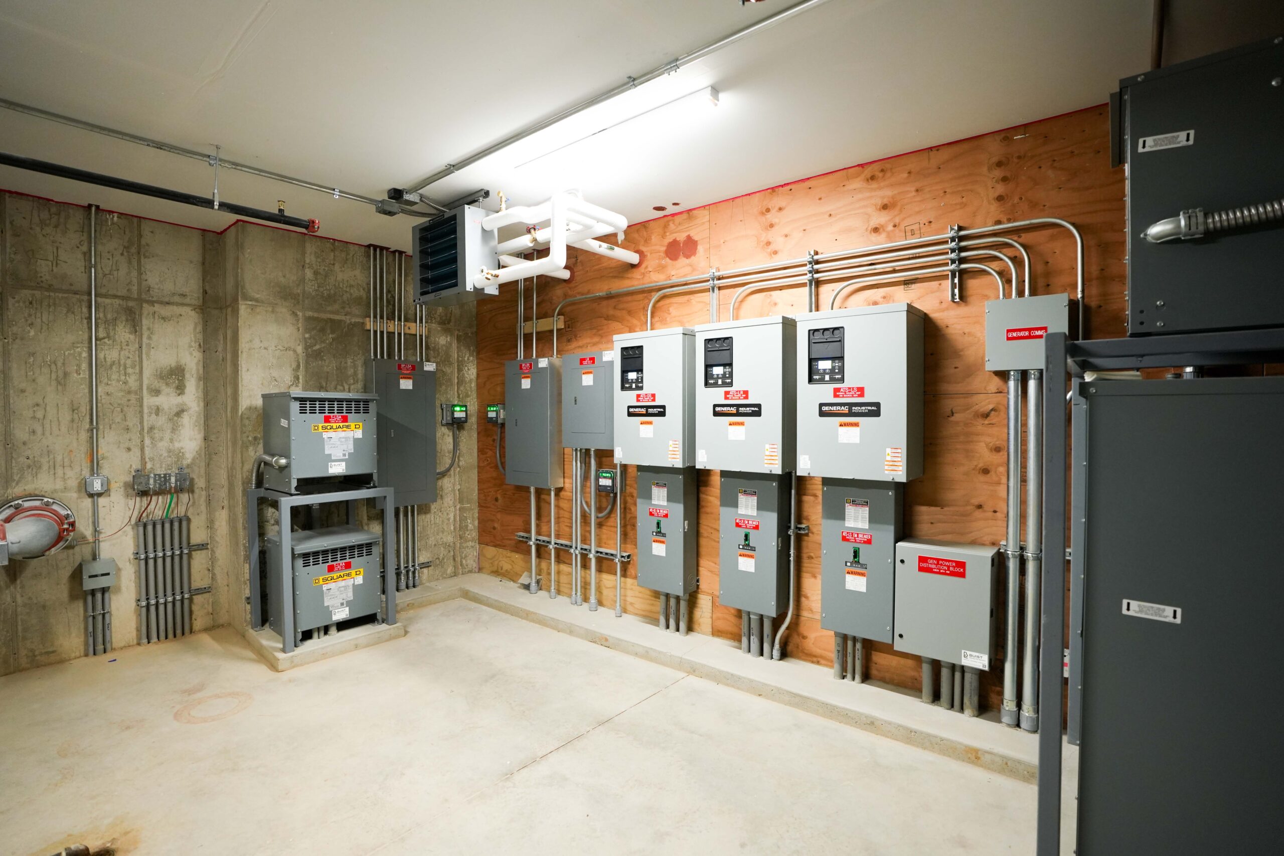 Electrical room at Calvin Theological Seminary housing with power distribution equipment installed by Buist.