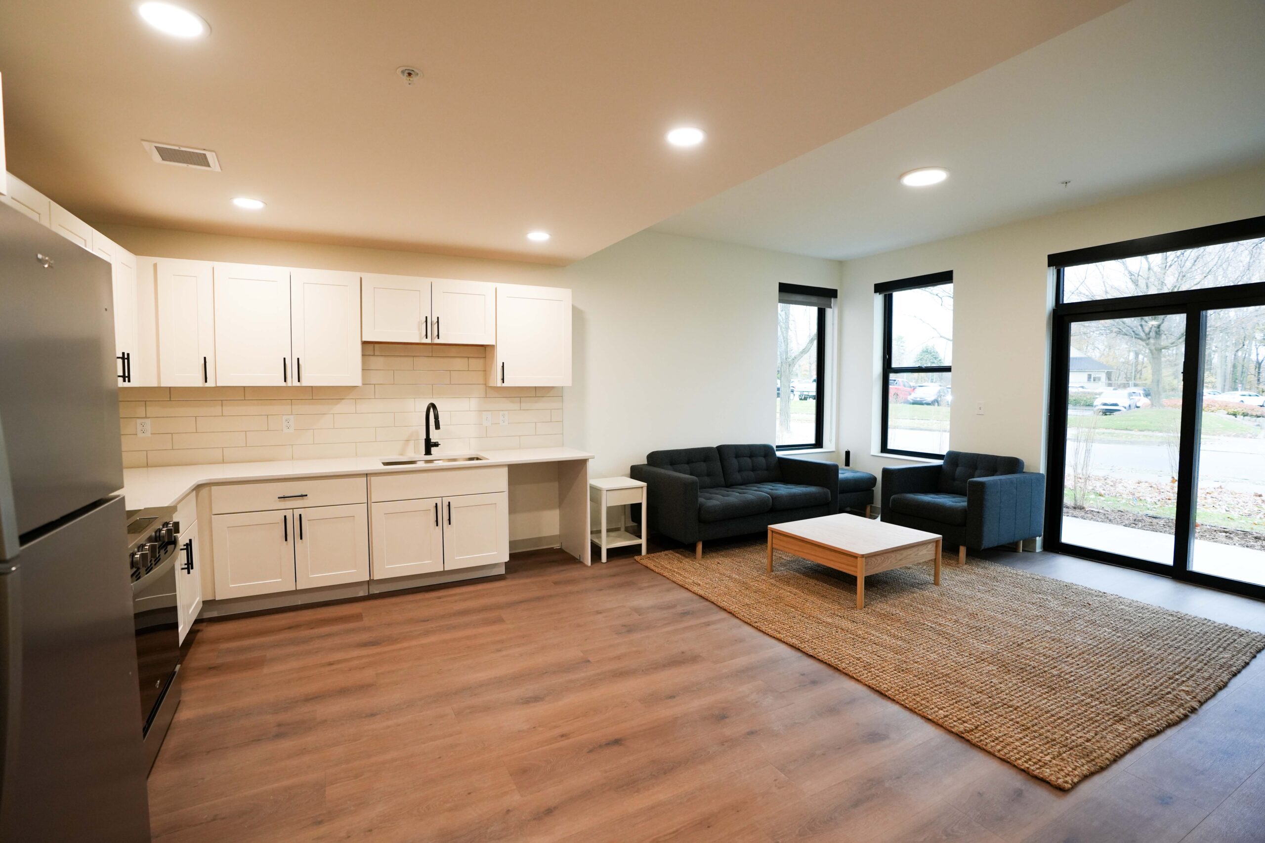 Apartment living space at Calvin Theological Seminary housing with lighting and electrical systems by Buist.