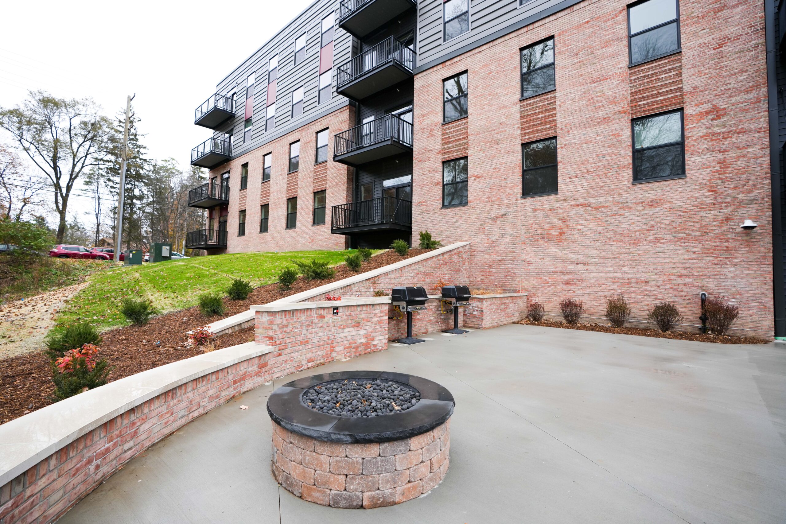 Outdoor community space at Calvin Theological Seminary housing with exterior lighting and power installed by Buist.
