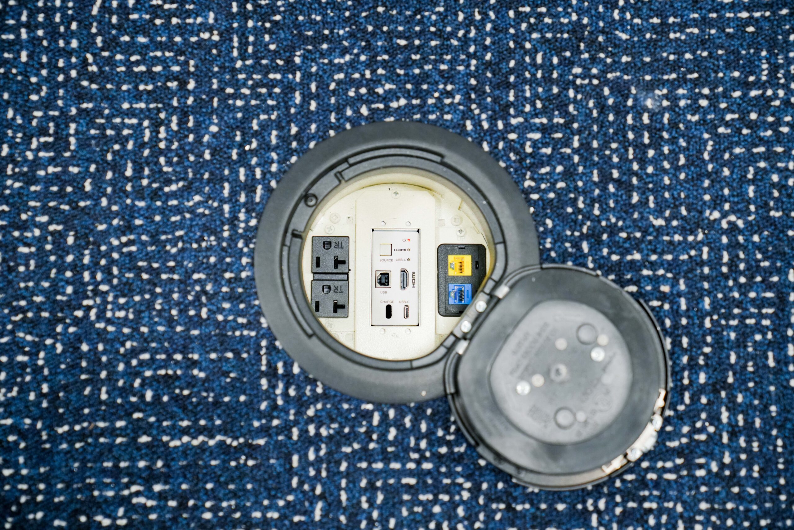 Floor box with power, data, and AV connections installed by Buist at GE Aerospace