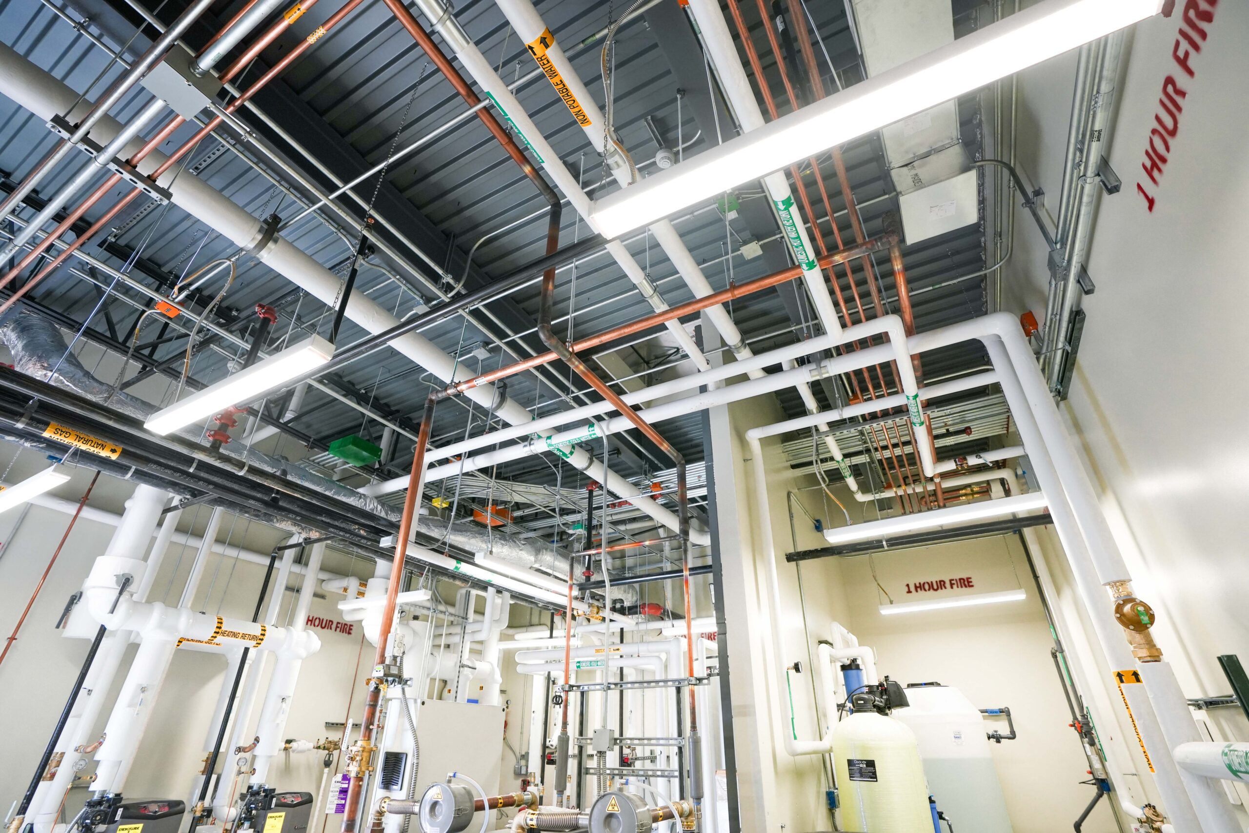 Mechanical room with piping systems and utilities infrastructure at Corewell Health Endoscopy Facility Grand Rapids Michigan
