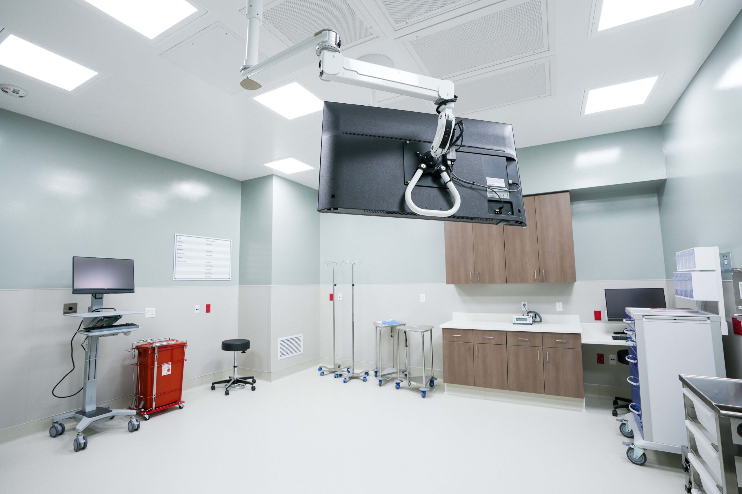 Operating room with overhead monitor and medical equipment at Corewell Health Endoscopy Facility in Grand Rapids Michigan