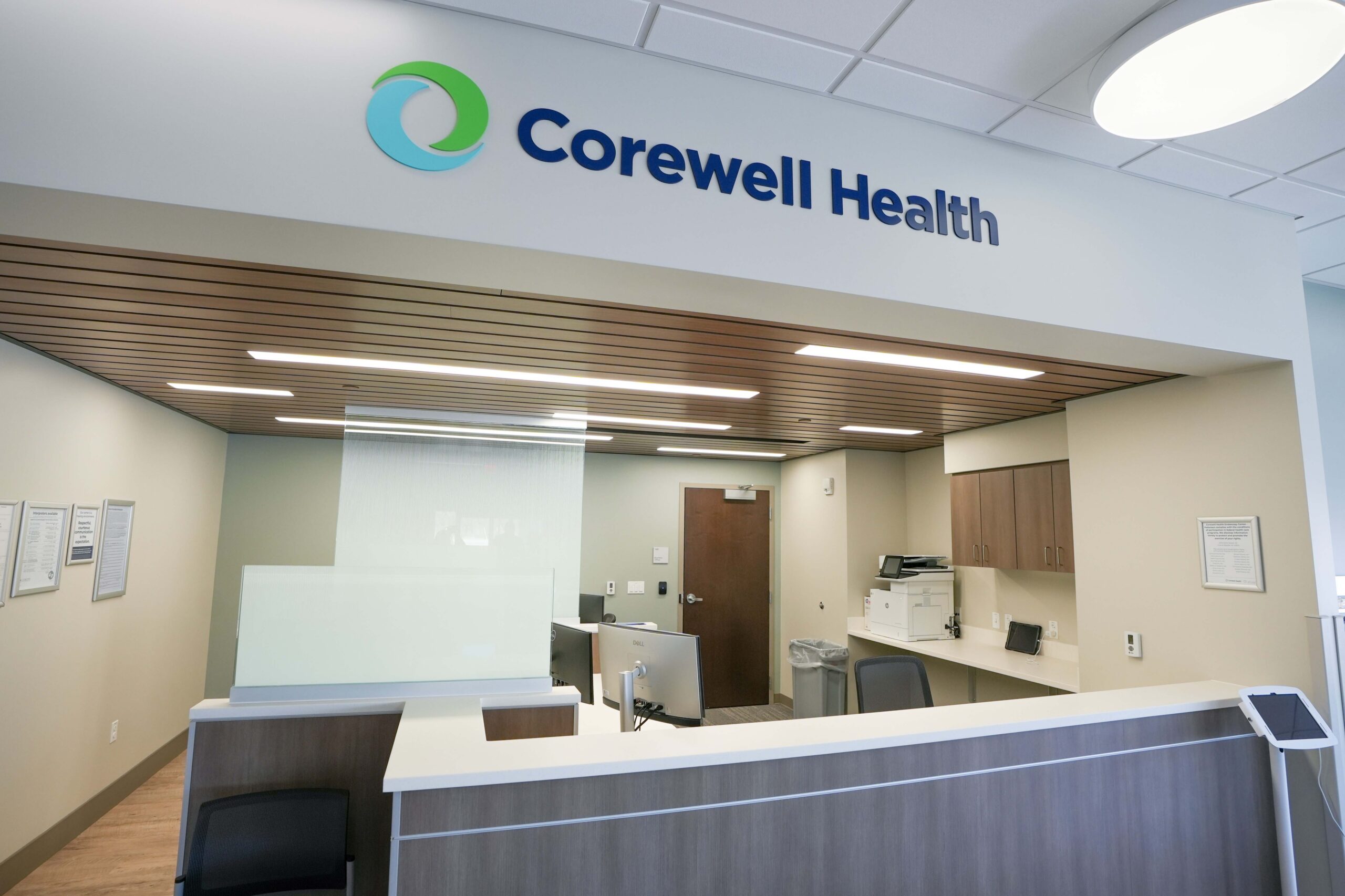 Reception desk with Corewell Health signage inside endoscopy facility in Grand Rapids Michigan