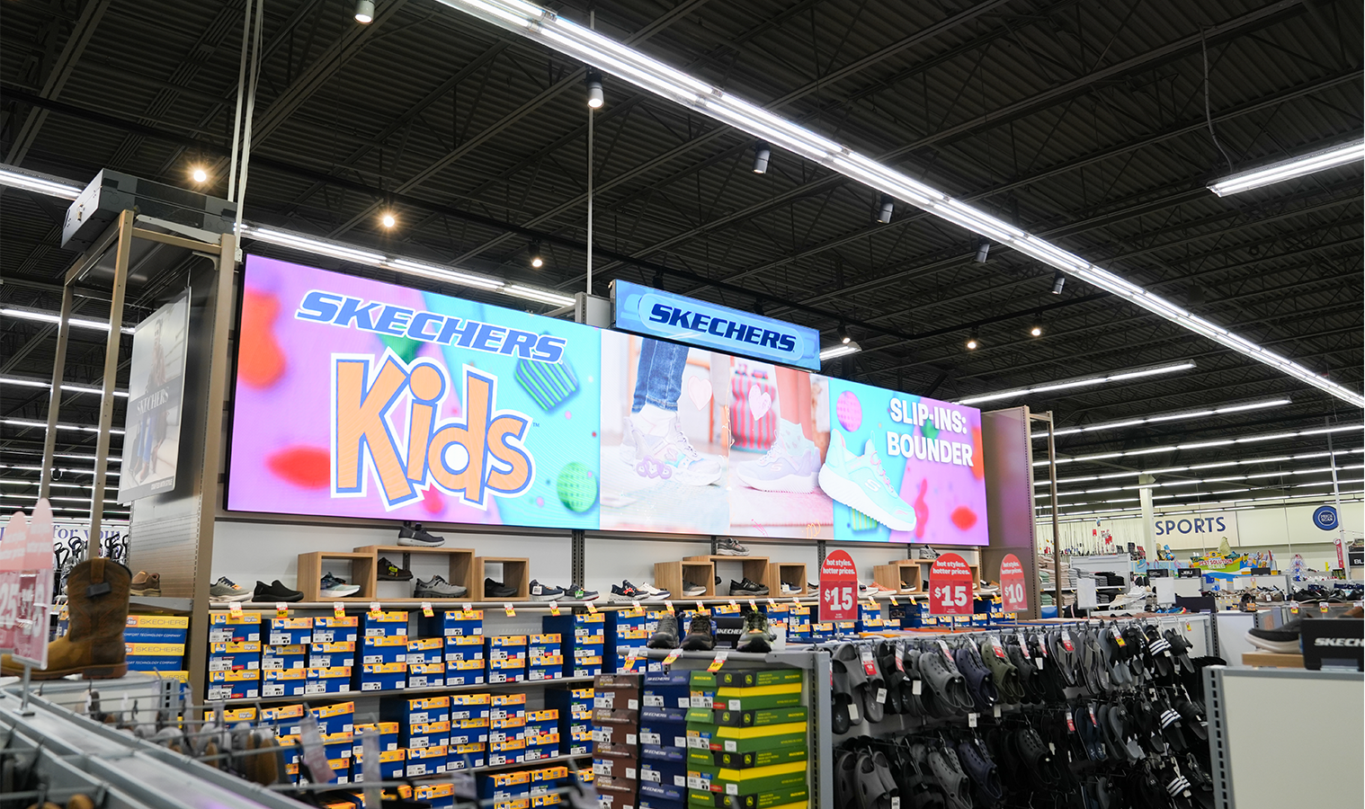 Large-format digital signage display in the Skechers department at Meijer Knapp's Corner.
