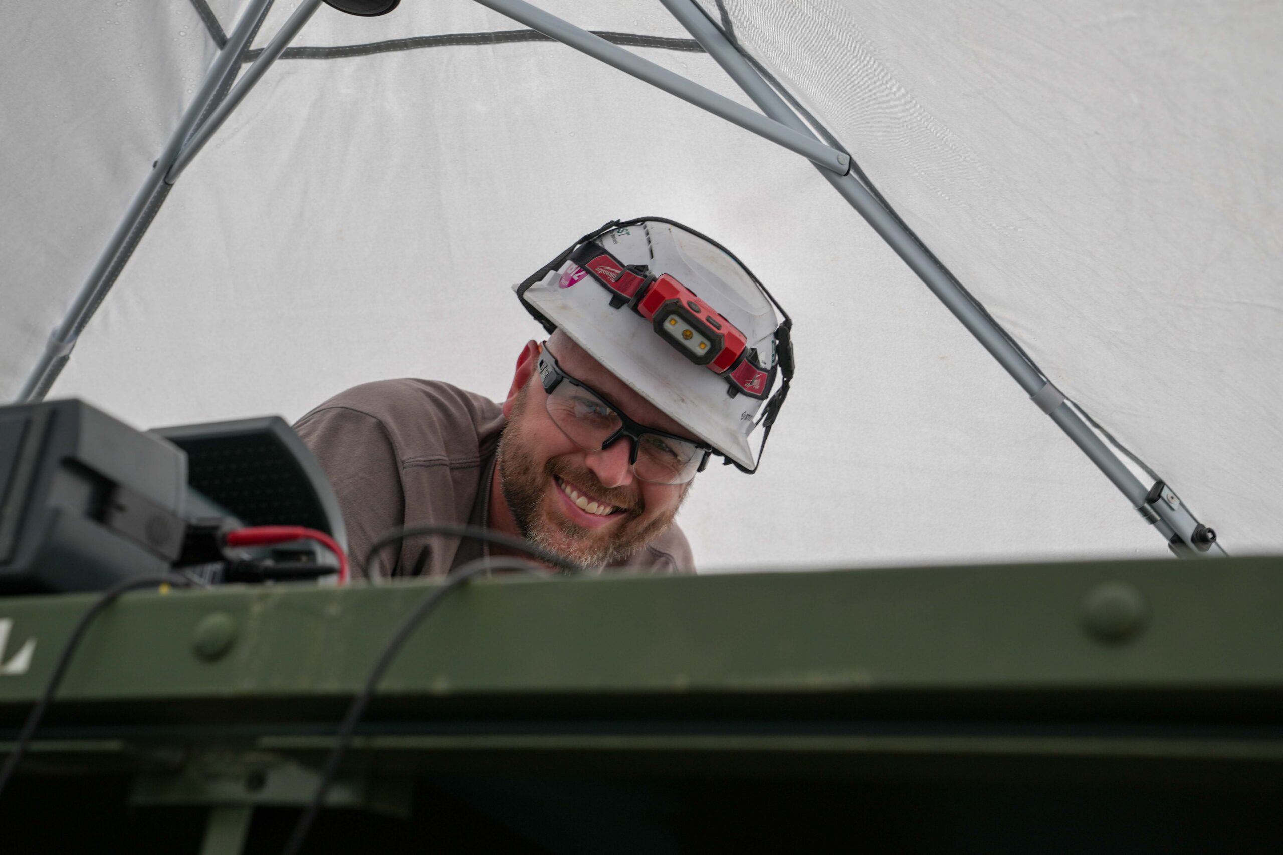 Buist electrical testing technician wearing PPE while performing field testing on electrical equipment during a scheduled maintenance outage.