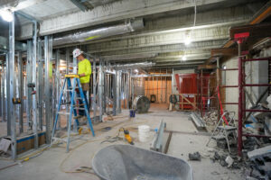 Buist electrician working inside the Alpha Grand Rapids renovation.
